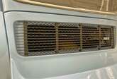 Duck tail with mounted black grille.